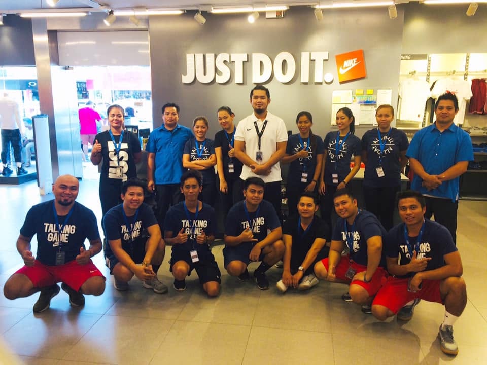 Nike Factory Store team gathered inside the store